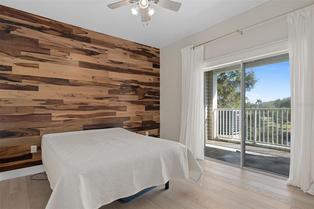 8304 Aquila Street Port Richey, FL 34668 - Photo 23 of 65 a bedroom with a bed and a window