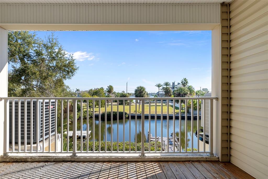 8304 Aquila Street Port Richey, FL 34668 - Photo 25 of 65 a view of a balcony with a potted plant