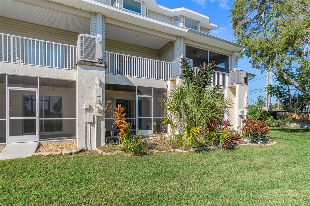 8304 Aquila Street Port Richey, FL 34668 - Photo 44 of 65 a front view of a house with garden