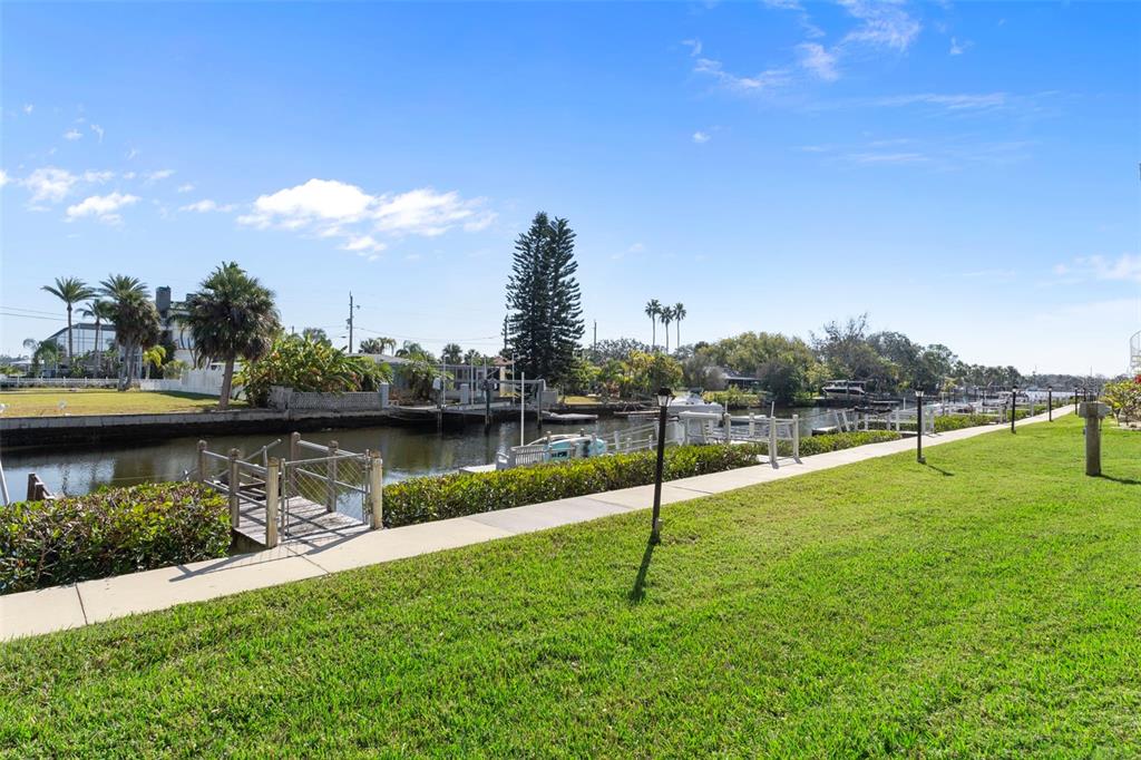 8304 Aquila Street Port Richey, FL 34668 - Photo 46 of 65 a view of a lake with a yard