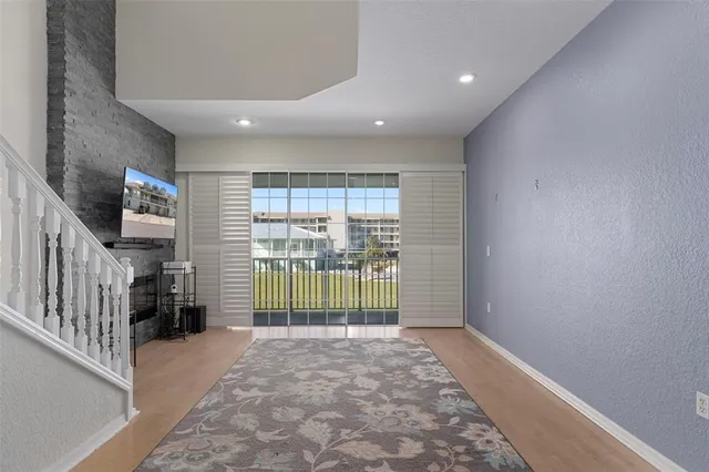a view of a livingroom with furniture and staircase