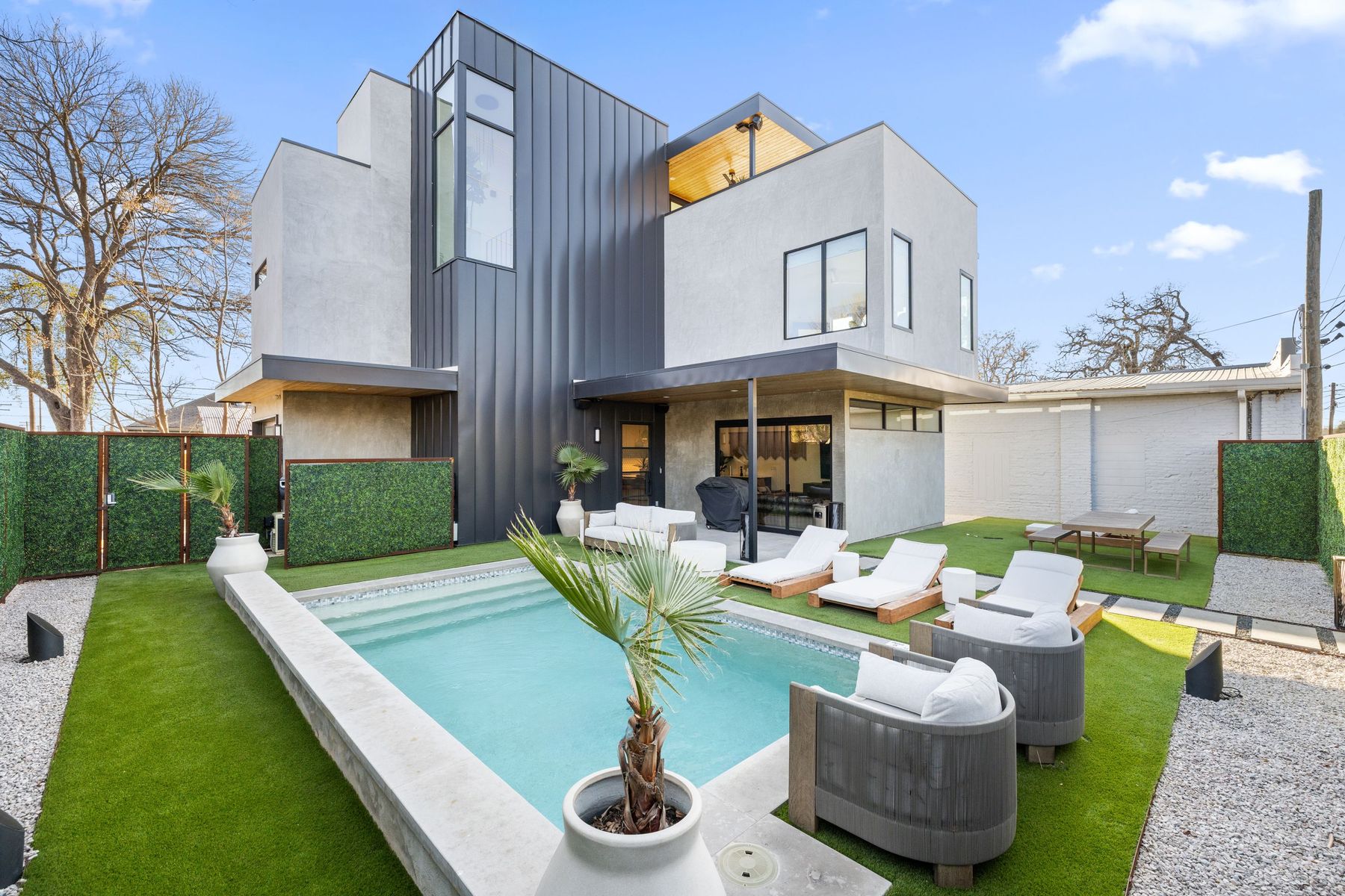 1304 Comal Street Austin, TX 78702 - Photo 1 of 39 a view of a patio with couches table and chairs and potted plants