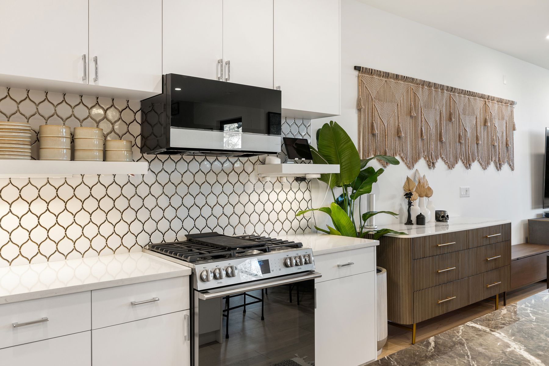 1304 Comal Street Austin, TX 78702 - Photo 11 of 39 a kitchen with a stove and a white wooden cabinets