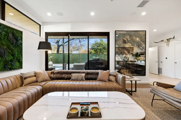 a living room with furniture and a large window