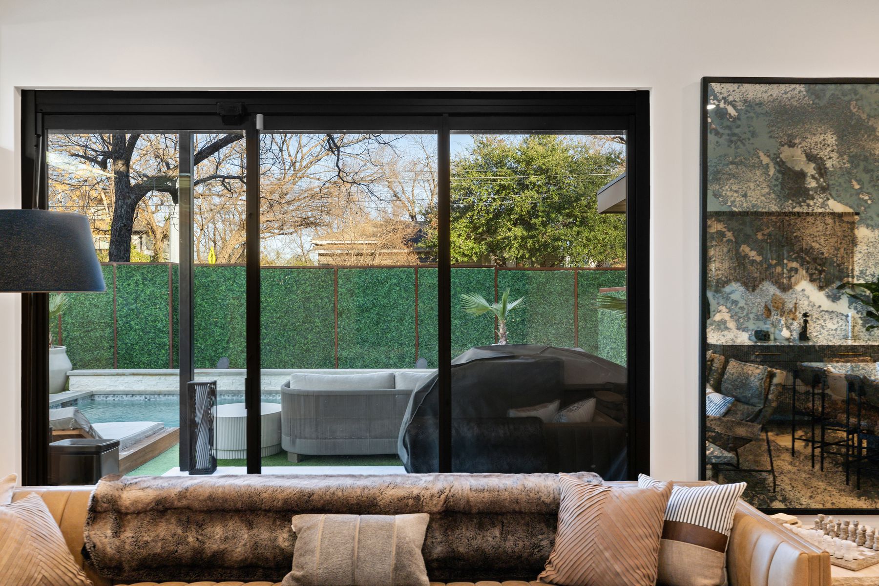 1304 Comal Street Austin, TX 78702 - Photo 13 of 39 a living room with a couch and a floor to ceiling window