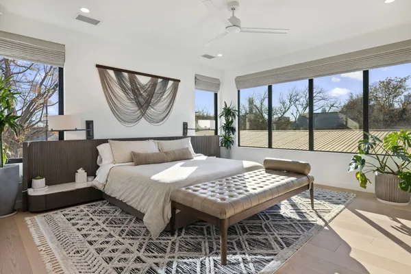 a bedroom with a bed and a table