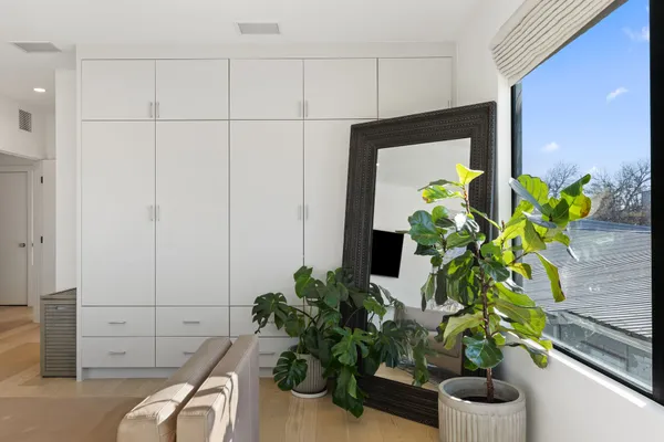 a plant sitting inside of a cabinet