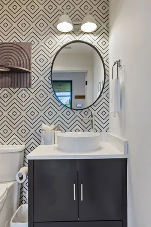 a bathroom with a sink and mirror