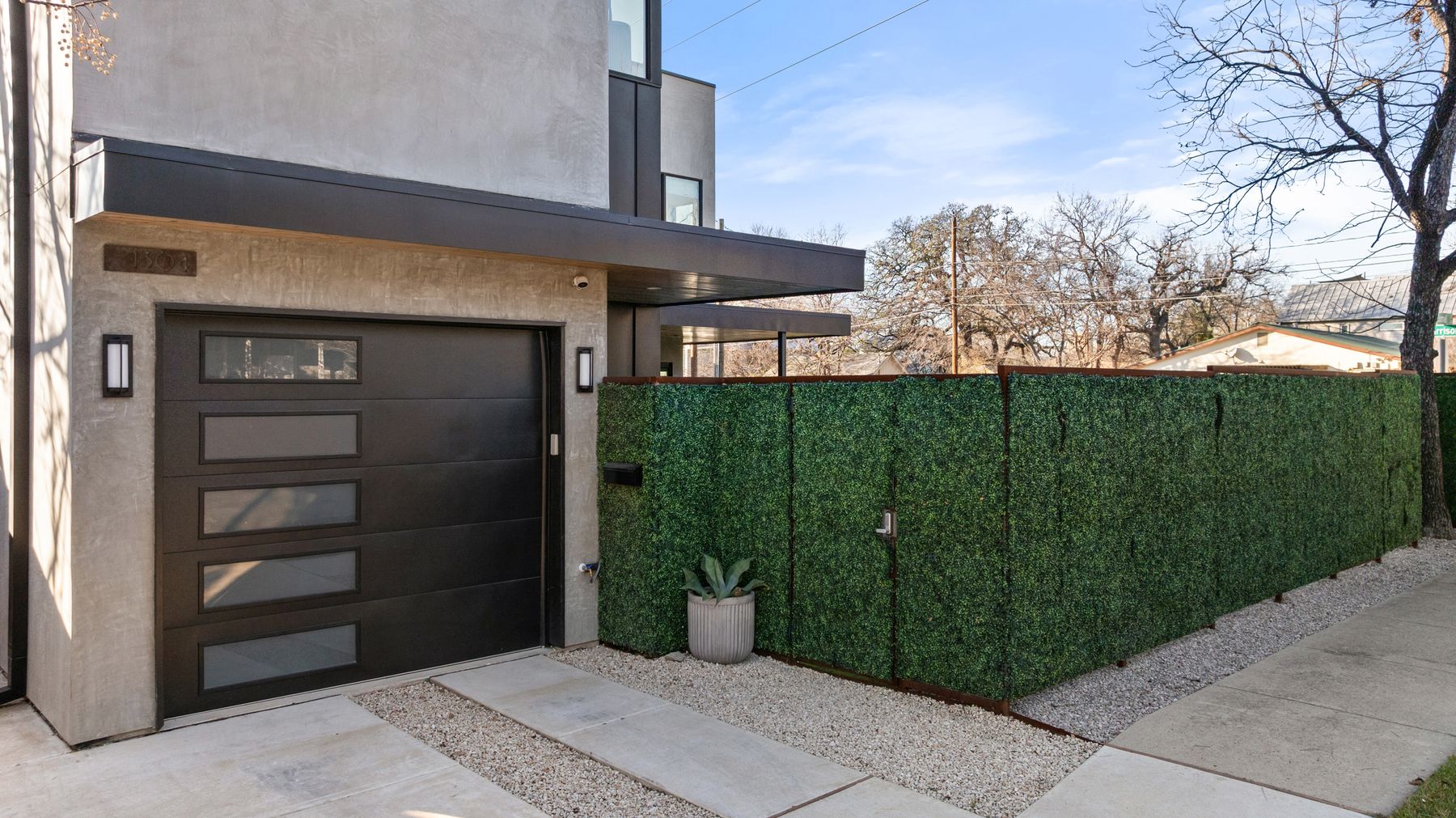 1304 Comal Street Austin, TX 78702 - Photo 37 of 39 a view of a entrance gate of the house and trees