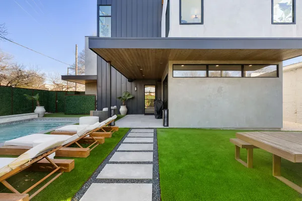 a view of a backyard with sitting area