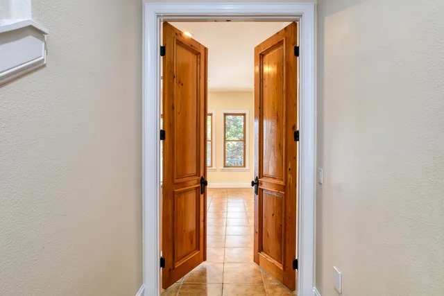 a kitchen with stainless steel appliances granite countertop a stove a refrigerator and a sink