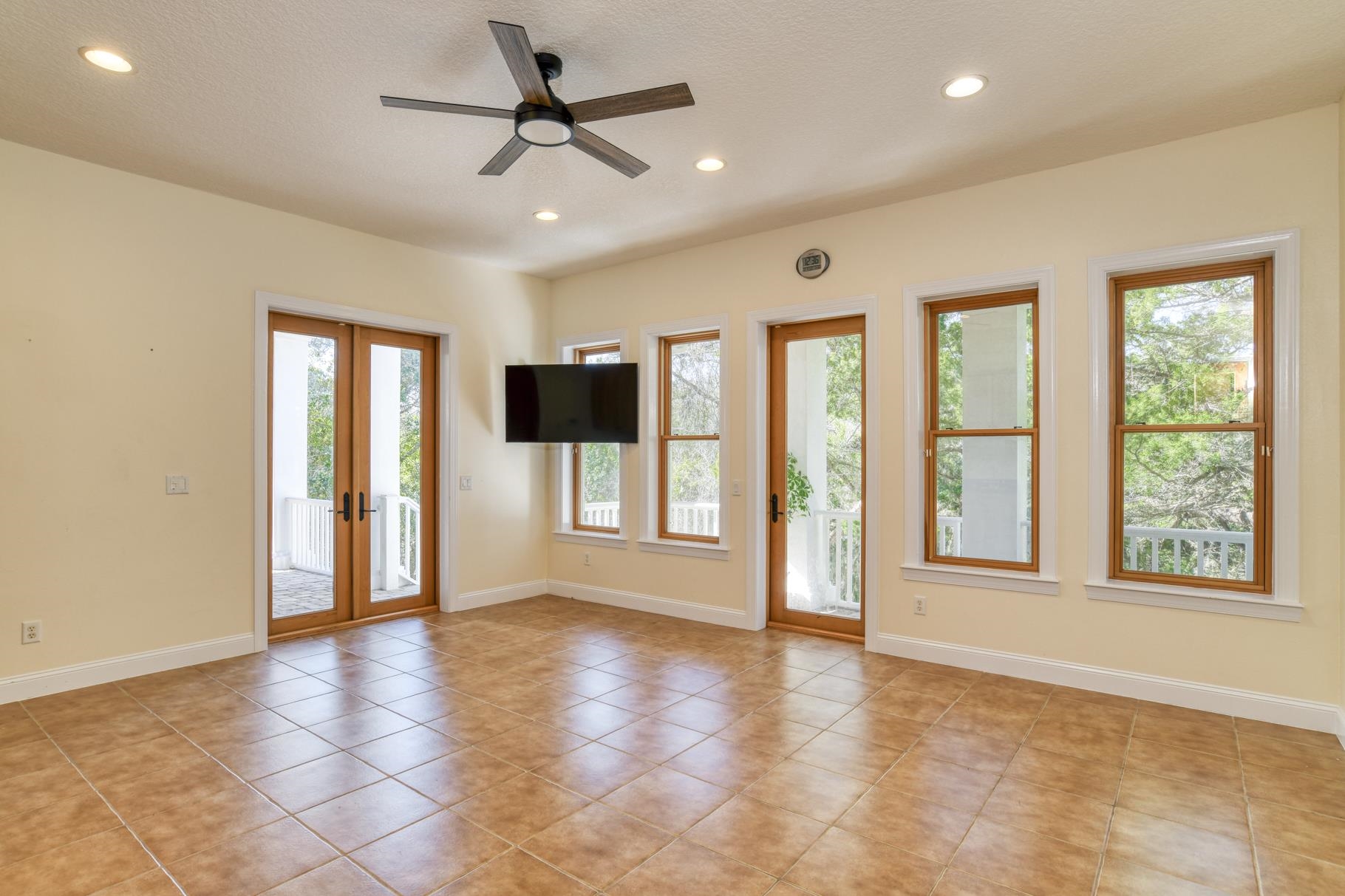 201 North Forest Dune Drive St. Augustine Beach, FL 32080 - Photo 12 of 57 a view of an empty room with a window and a kitchen area