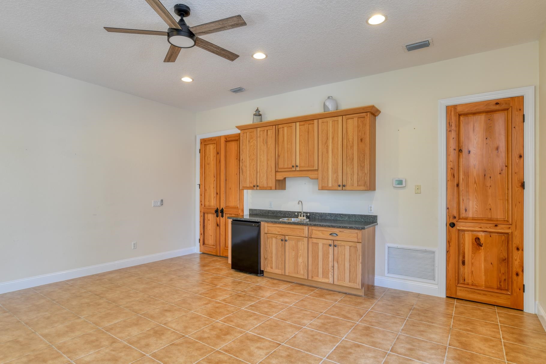 201 North Forest Dune Drive St. Augustine Beach, FL 32080 - Photo 13 of 57 a kitchen with stainless steel appliances granite countertop a stove a refrigerator and a sink