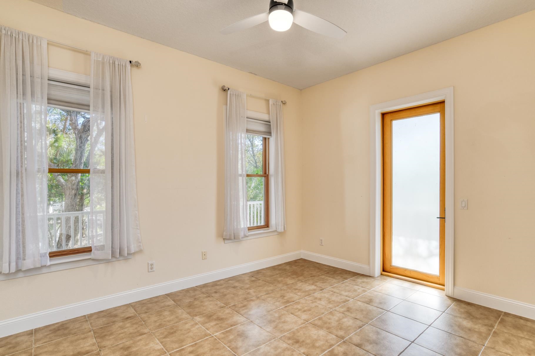 201 North Forest Dune Drive St. Augustine Beach, FL 32080 - Photo 14 of 57 a view of an empty room with window and carpet