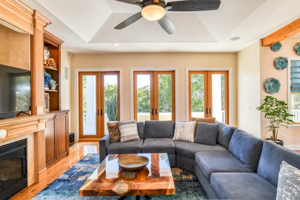 a kitchen with stainless steel appliances granite countertop a refrigerator a stove and a sink