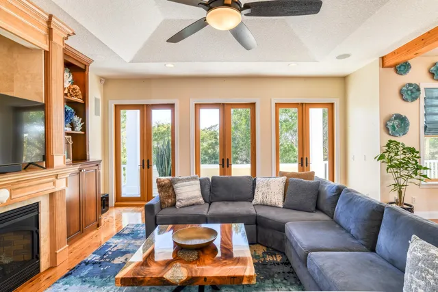 a kitchen with stainless steel appliances granite countertop a refrigerator a stove and a sink