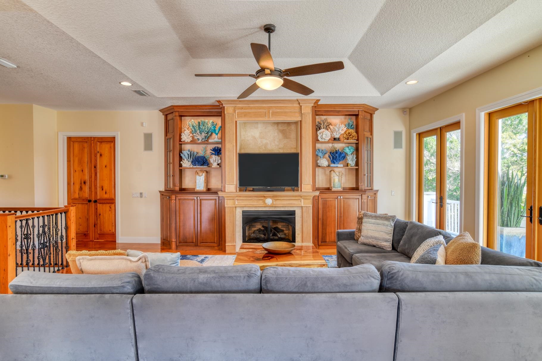 201 North Forest Dune Drive St. Augustine Beach, FL 32080 - Photo 20 of 57 a living room with furniture a flat screen tv and a fireplace