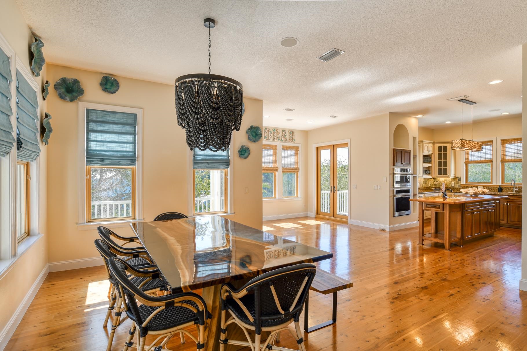 201 North Forest Dune Drive St. Augustine Beach, FL 32080 - Photo 23 of 57 a view of a dining room with furniture window and wooden floor