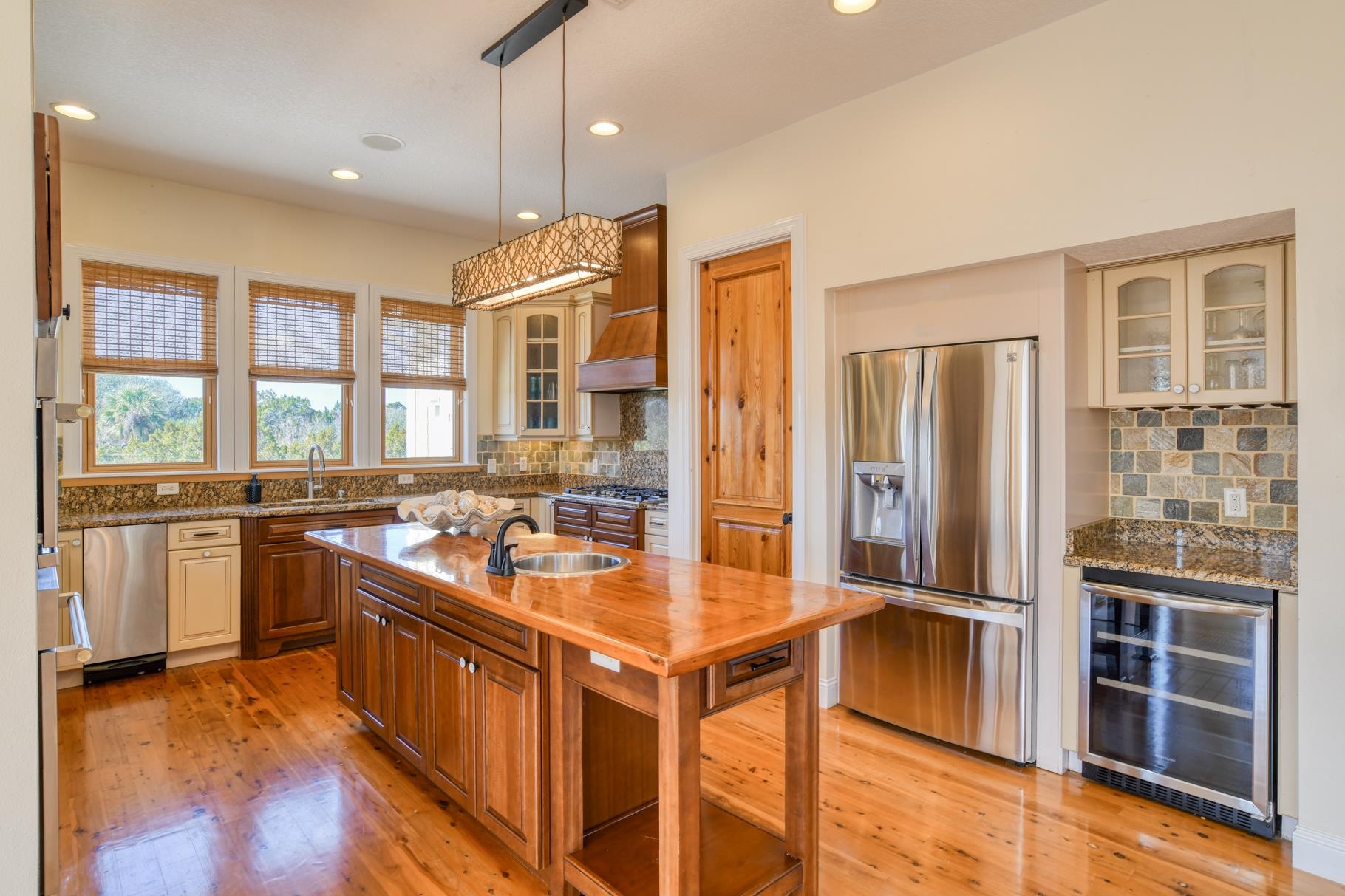 201 North Forest Dune Drive St. Augustine Beach, FL 32080 - Photo 25 of 57 a kitchen with stainless steel appliances granite countertop a refrigerator a stove and a sink
