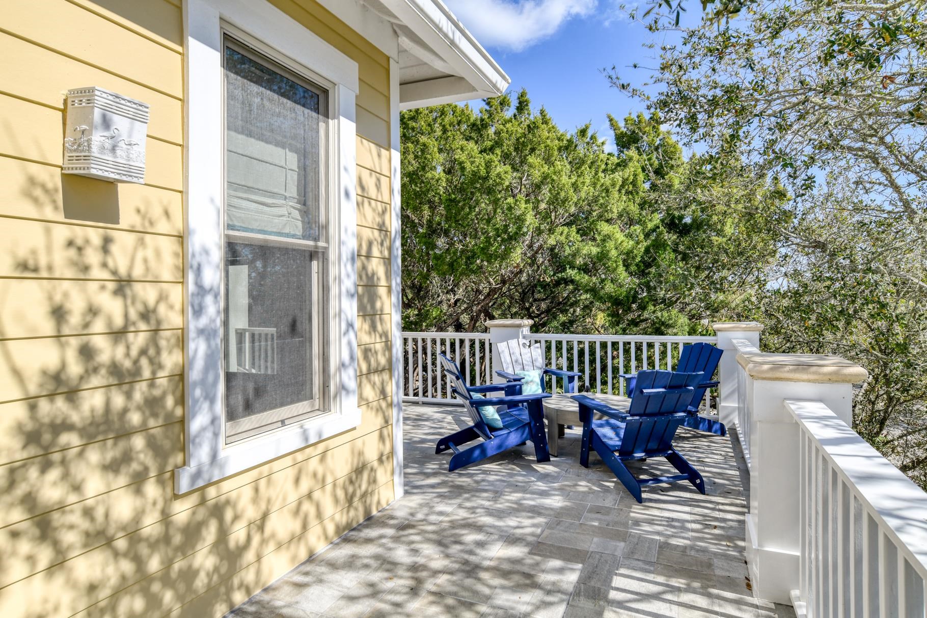 201 North Forest Dune Drive St. Augustine Beach, FL 32080 - Photo 29 of 57 a view of a chairs and tables in the balcony