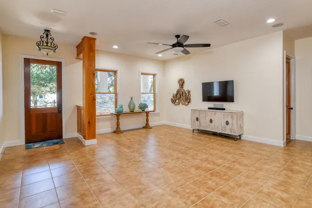 a view of livingroom with hardwood floor and a flat screen tv