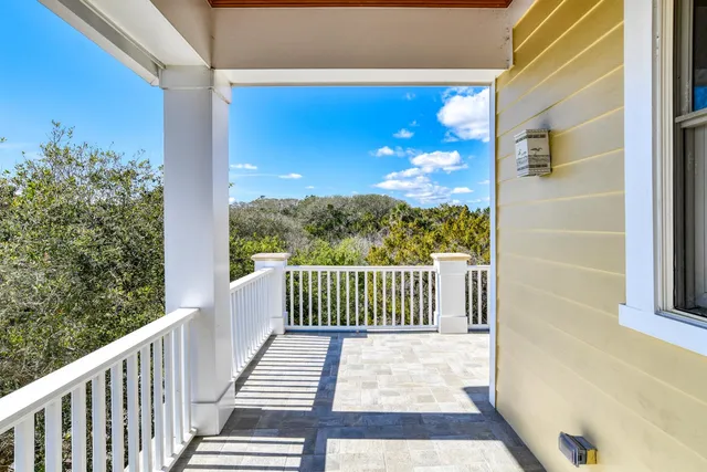 a bathroom with a sink mirror and toilet
