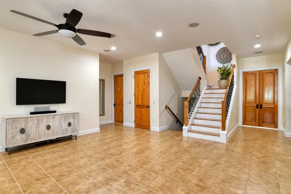 a view of an empty room with a flat screen tv