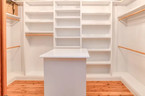 a front view of a house with a yard and a street