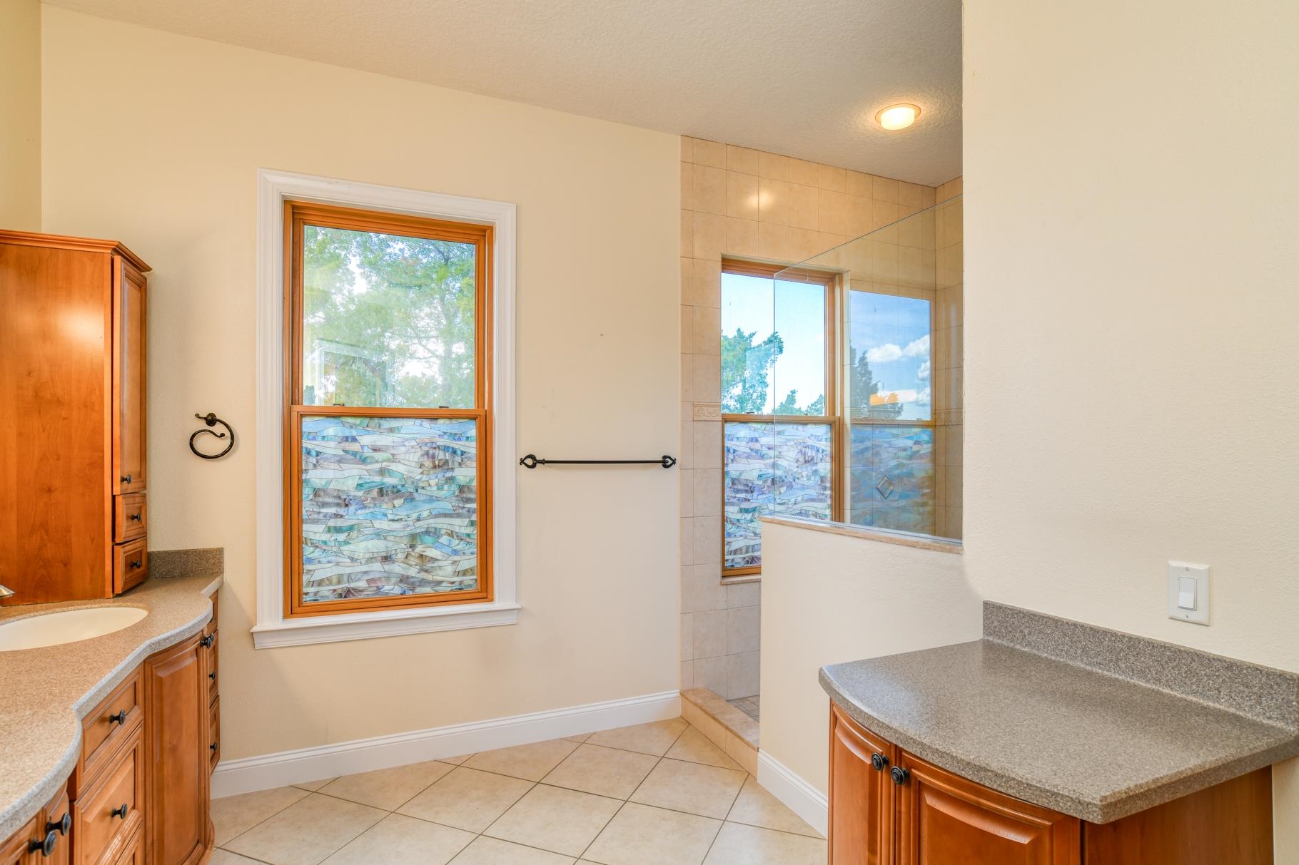 201 North Forest Dune Drive St. Augustine Beach, FL 32080 - Photo 44 of 57 a kitchen with a window a sink and a cabinet