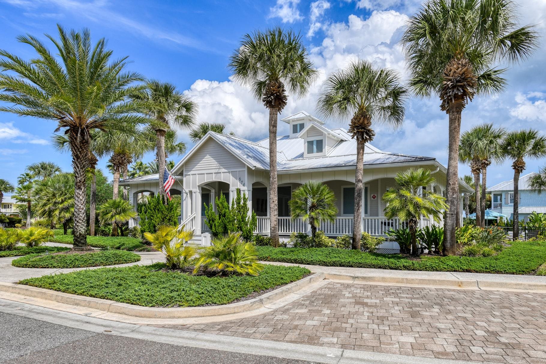 201 North Forest Dune Drive St. Augustine Beach, FL 32080 - Photo 49 of 57 a front view of a house with a garden and a yard