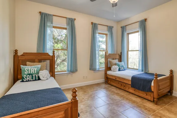 a bedroom with a bed and window