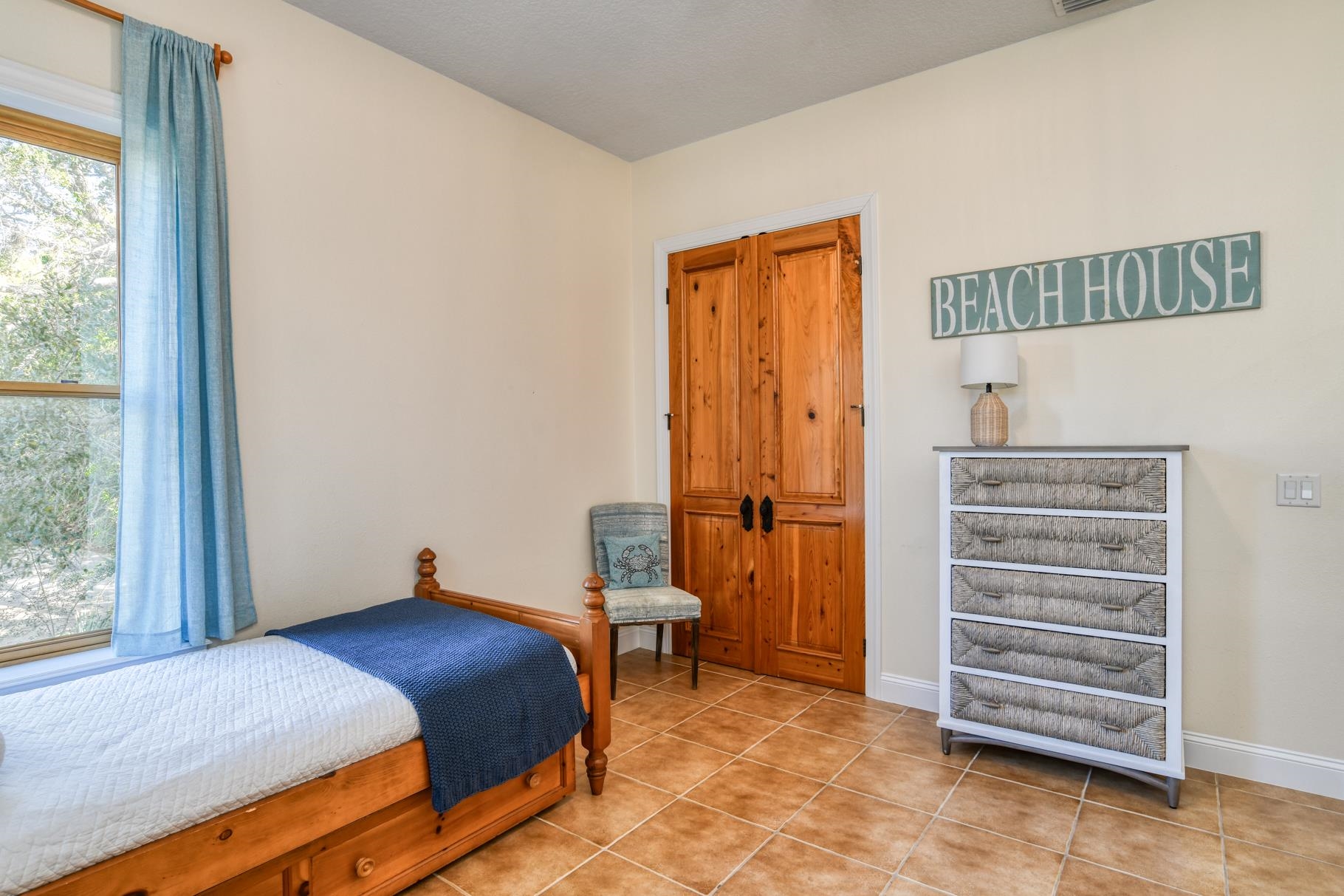 201 North Forest Dune Drive St. Augustine Beach, FL 32080 - Photo 6 of 57 a bedroom with a bed and a window