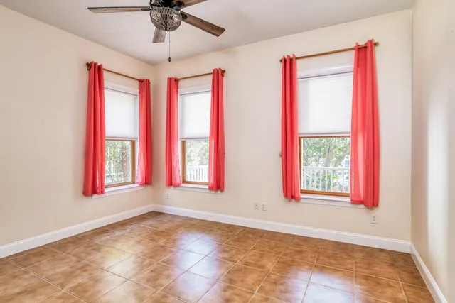 a view of a livingroom with wooden floor and cabinet