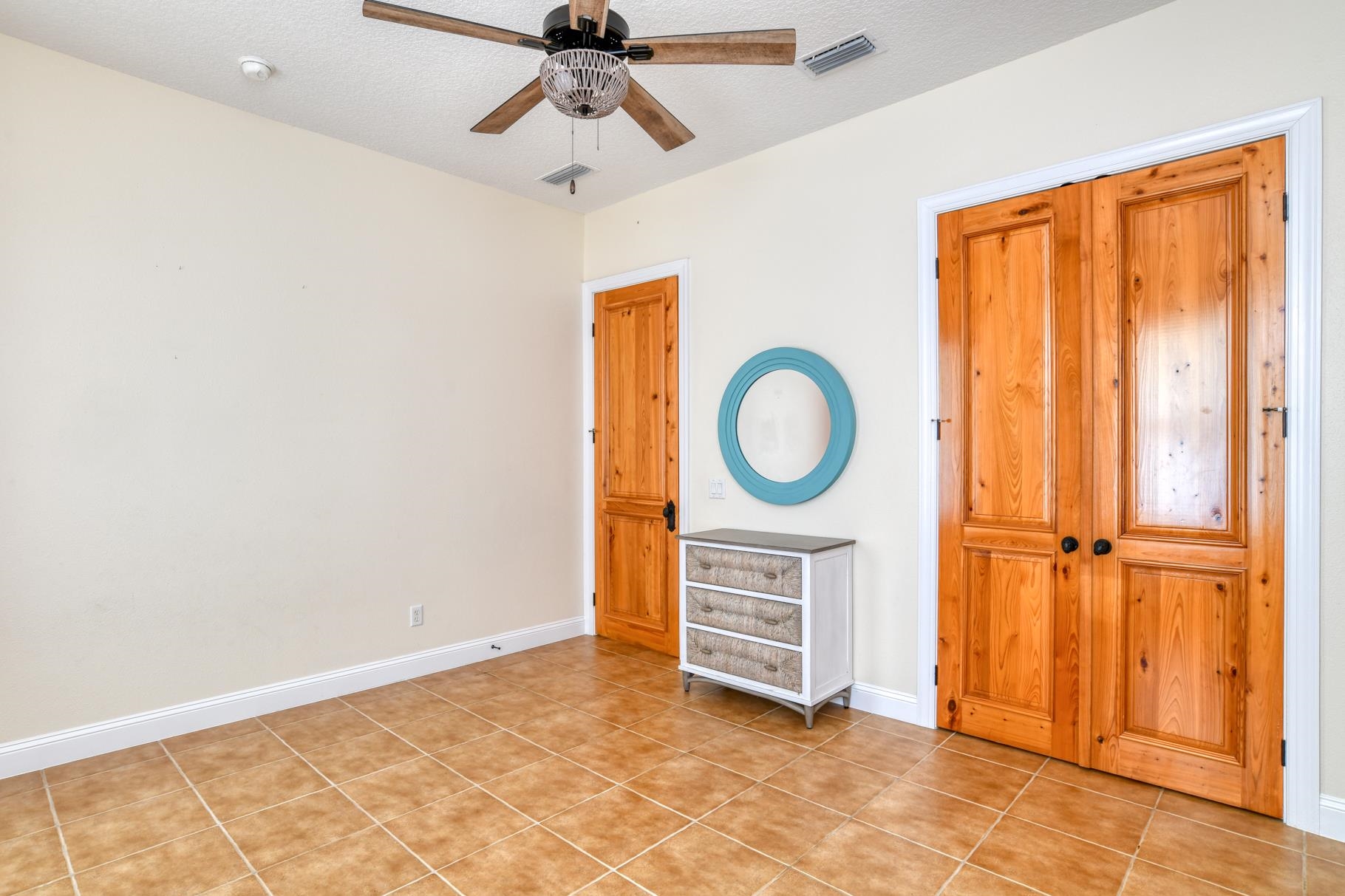 201 North Forest Dune Drive St. Augustine Beach, FL 32080 - Photo 10 of 57 a view of a livingroom with wooden floor and cabinet