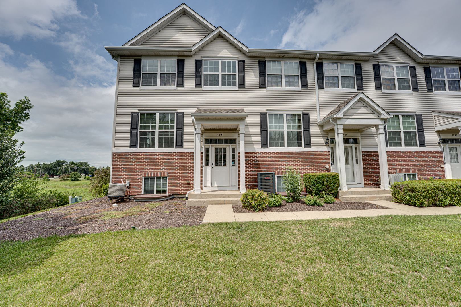 3821 Bailey Road, Unit 3821 Yorkville, IL 60560 - Photo 1 of 22 front view of a house with a yard