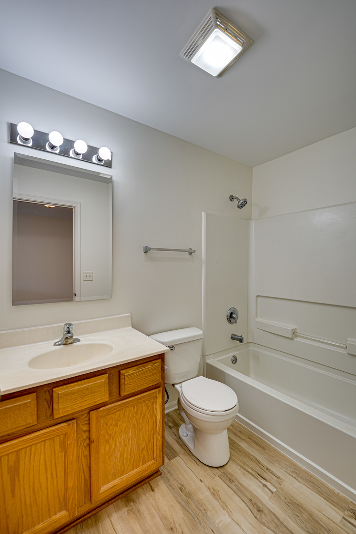 3821 Bailey Road, Unit 3821 Yorkville, IL 60560 - Photo 12 of 22 a bathroom with a sink a toilet and a bathtub
