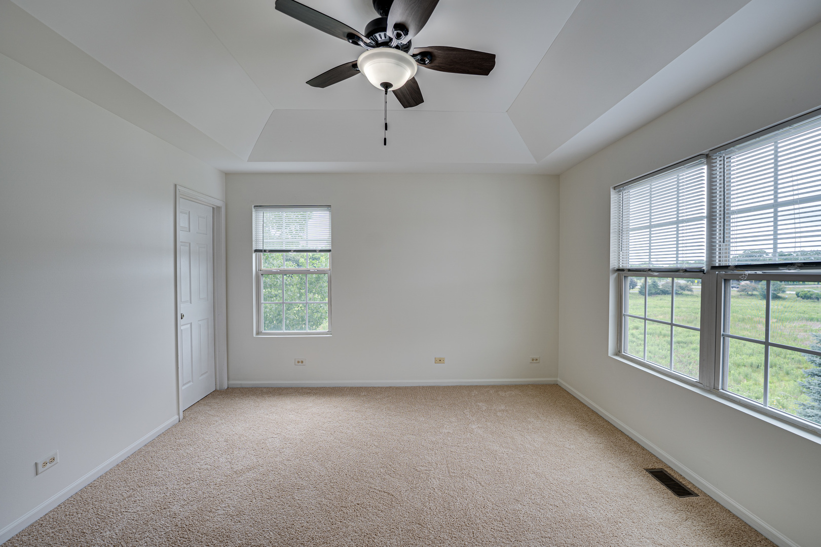 3821 Bailey Road, Unit 3821 Yorkville, IL 60560 - Photo 14 of 22 an empty room with windows and fan