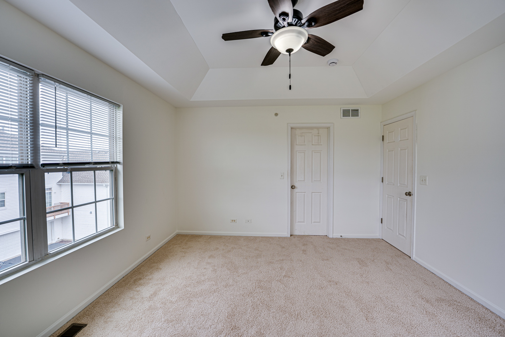 3821 Bailey Road, Unit 3821 Yorkville, IL 60560 - Photo 15 of 22 an empty room with windows and fan