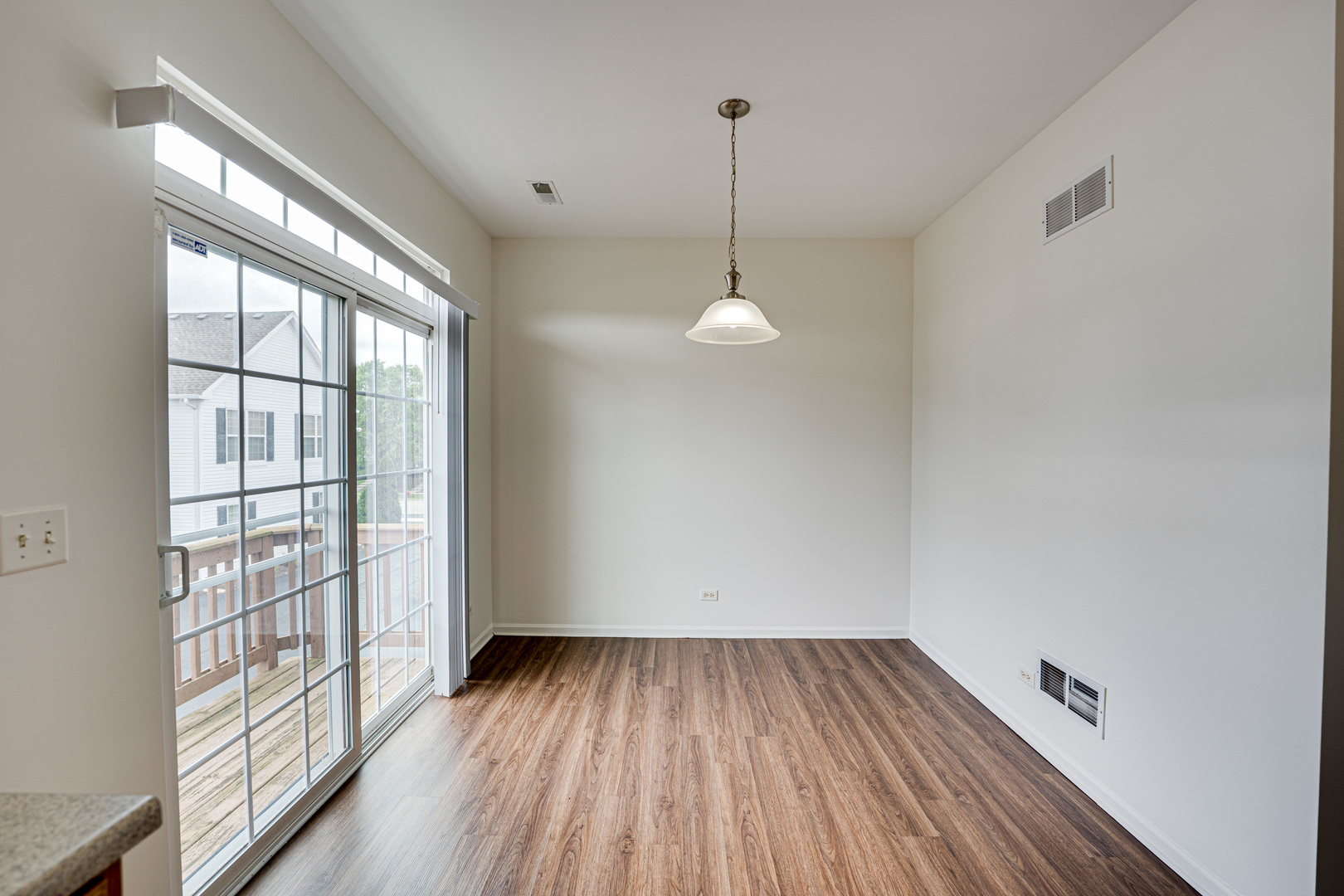 3821 Bailey Road, Unit 3821 Yorkville, IL 60560 - Photo 4 of 22 a view of empty room with wooden floor and fan