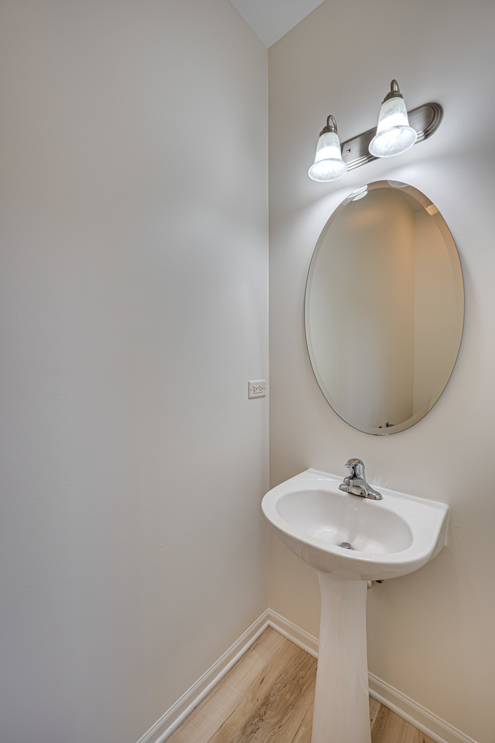 3821 Bailey Road, Unit 3821 Yorkville, IL 60560 - Photo 7 of 22 a bathroom with a sink and a mirror