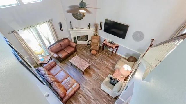 a kitchen with stainless steel appliances granite countertop a sink stove refrigerator and cabinets