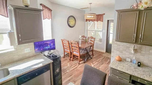 a view of a bedroom with furniture and window