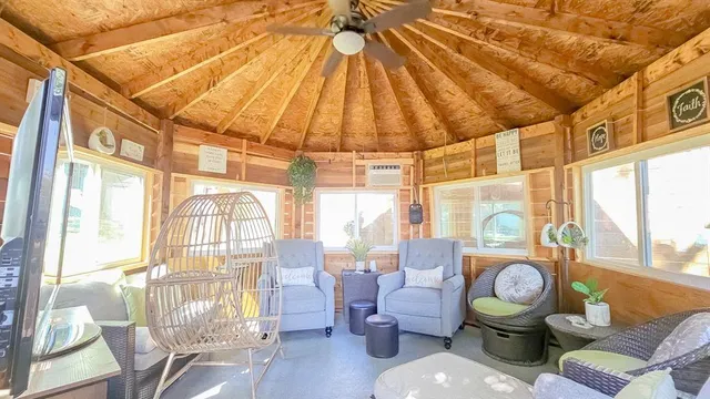 a living room filled with furniture and a table