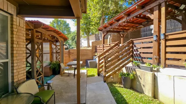 a view of balcony with furniture