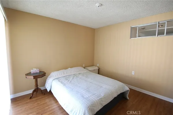 a bedroom with a bed and a table in it