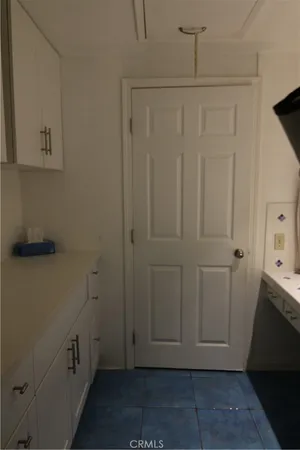 a view of cabinets and wooden floor