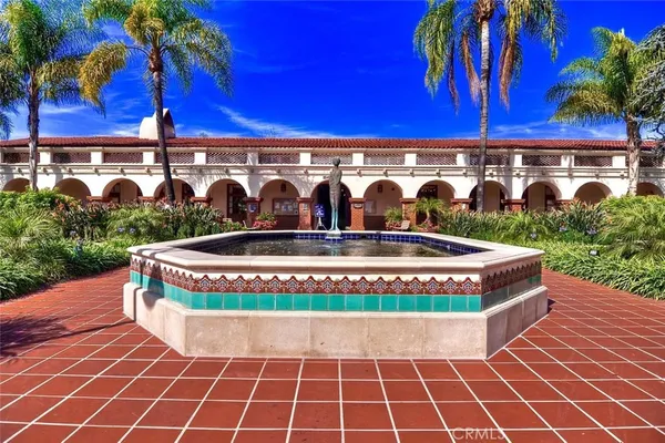 a front view of multiple houses with yard