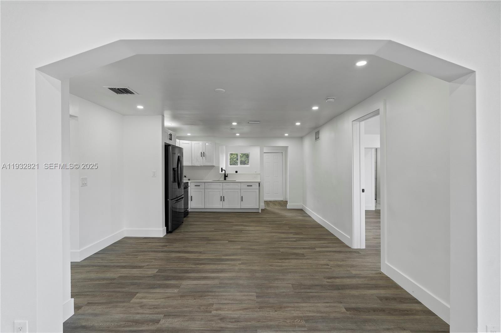 5658 Southwest 1st Street Miami, FL 33134 - Photo 14 of 41 a view of a kitchen with a sink and wooden floor