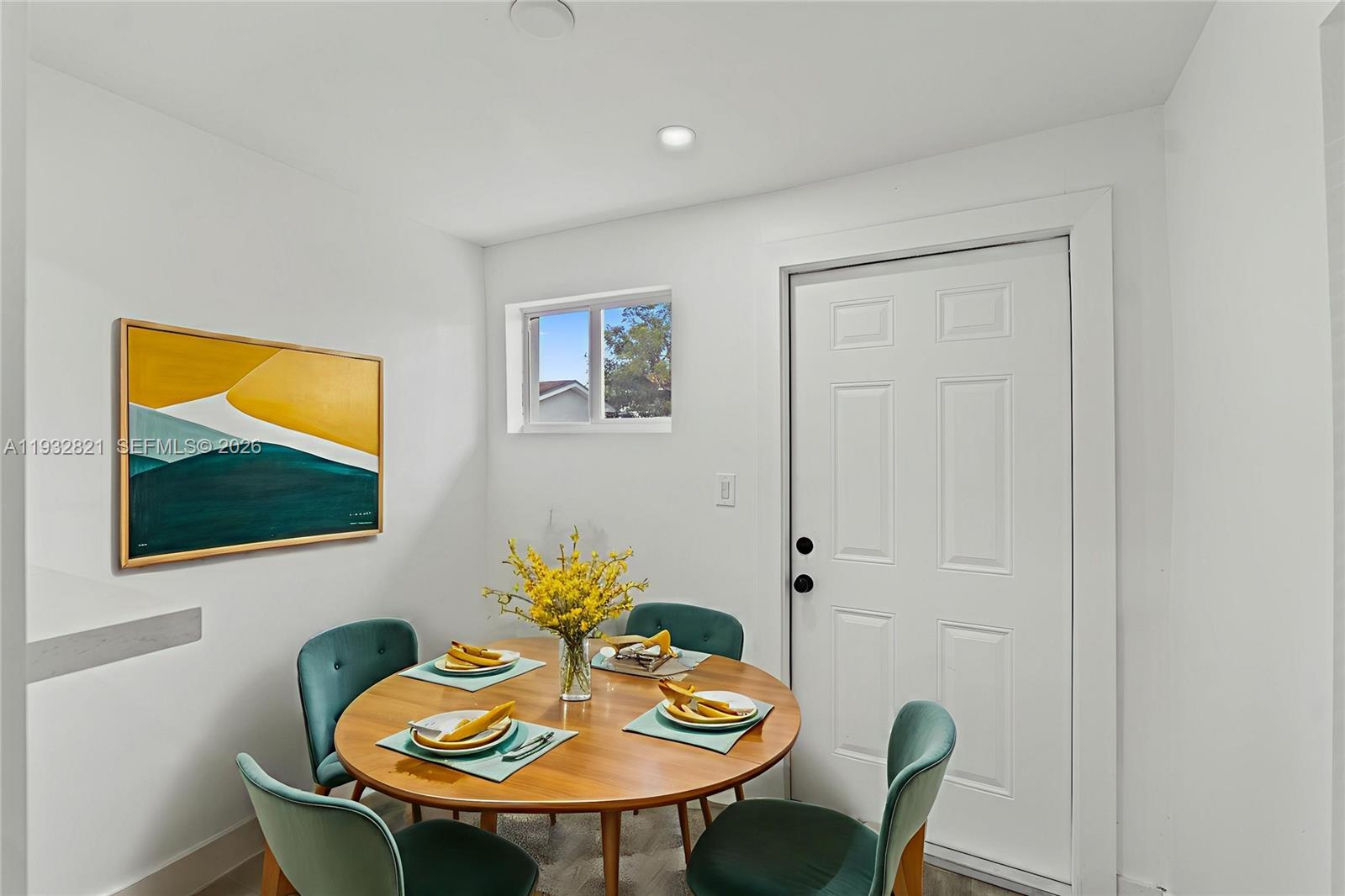 5658 Southwest 1st Street Miami, FL 33134 - Photo 25 of 50 a view of a dining room with furniture and wooden floor