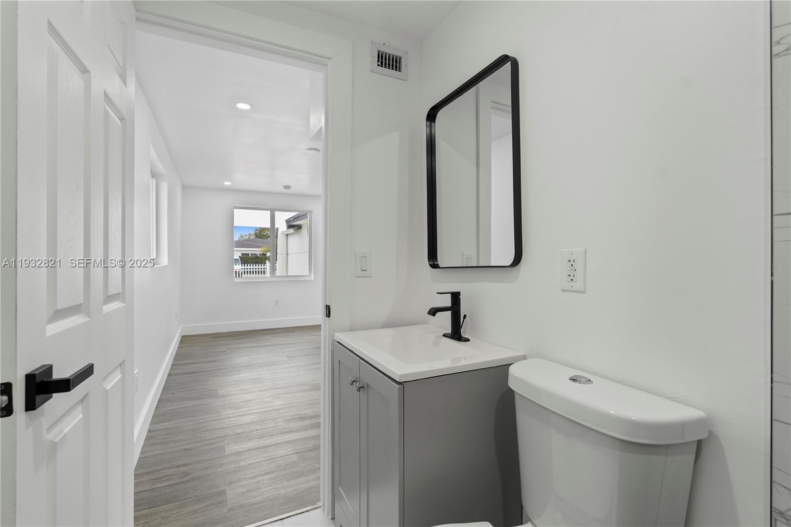 5658 Southwest 1st Street Miami, FL 33134 - Photo 29 of 41 a bathroom with a sink and a toilet